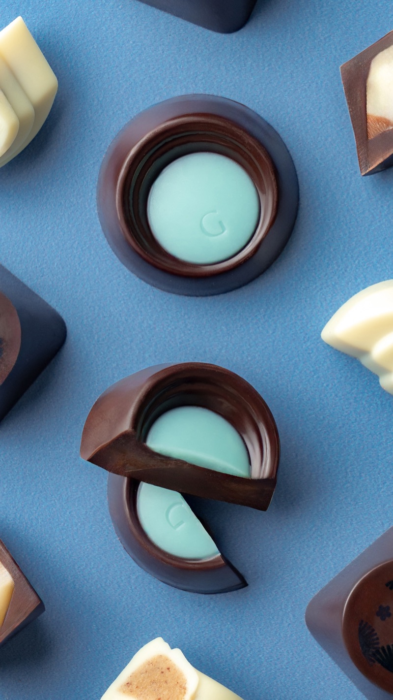 Assorted chocolates on a blue background